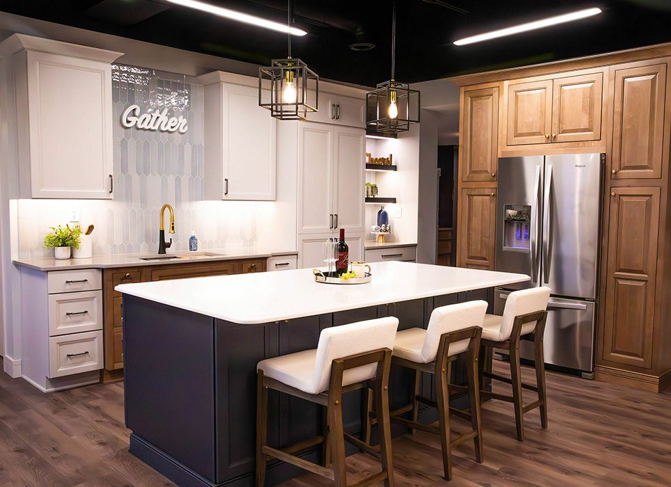 Kitchen with a large island in our showroom at Total Quality construction