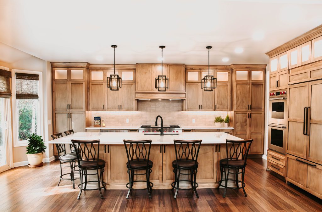 Newly updated, renovated kitchen with large island and wood cabinets.